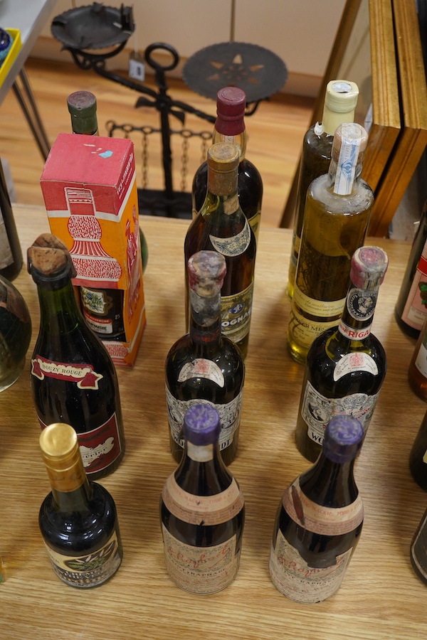 Twenty bottles of spirits, liqueurs and wine, together with some half bottles and miniatures, including; a 1947 Heidsieck & Co. Dry Monopole champagne, a 1983 Chateau Ferrande Bordeaux, two bottles of Herbes Mesclades, a